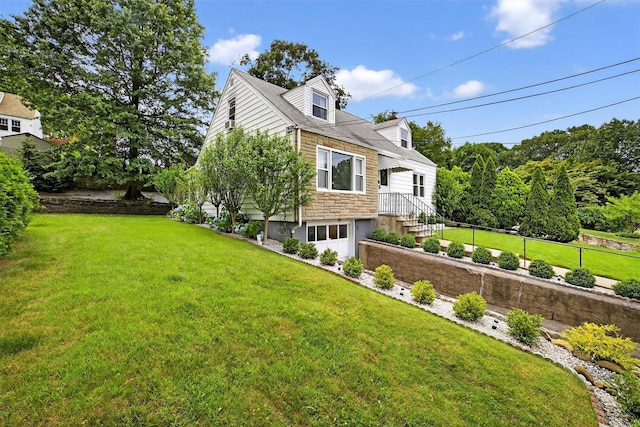 130 Cresthill Rd, Yonkers, NY 10710 - view of side of home featuring stone siding, a yard, and an attached garage