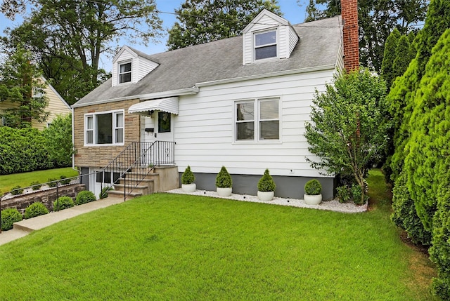 130 Cresthill Rd, Yonkers, NY 10710 - cape cod house with a front lawn, a chimney, roof with shingles, and stone siding