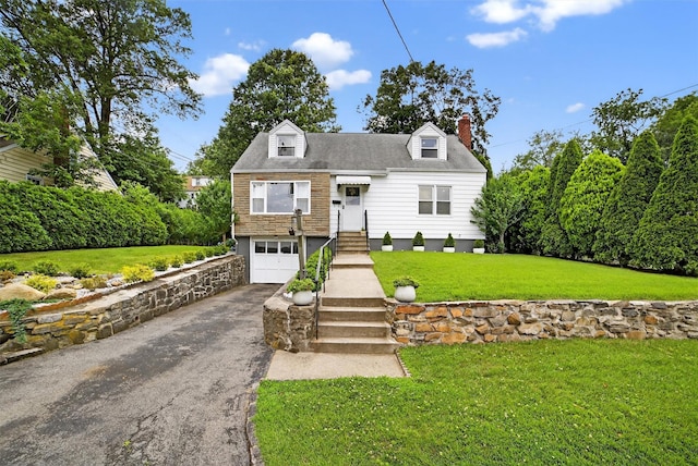 130 Cresthill Rd, Yonkers, NY 10710 - new england style home with driveway, an attached garage, a chimney, and a front lawn