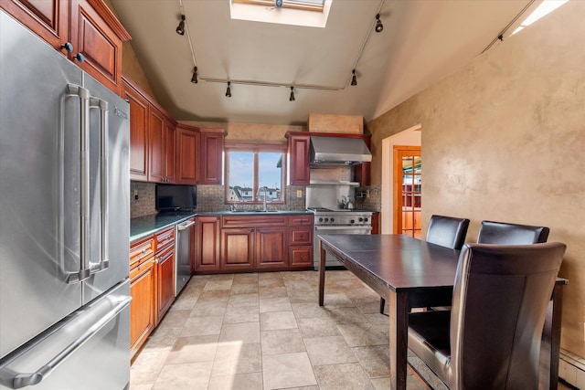 3337 Murdock Ave, Oceanside, NY 11572 - kitchen featuring premium appliances, track lighting, wall chimney exhaust hood, and plenty of natural light
