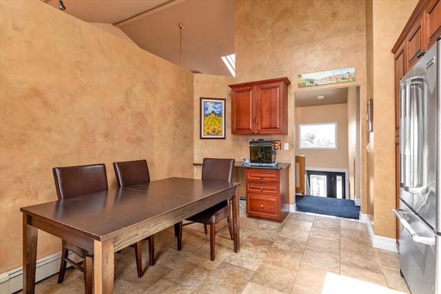 3337 Murdock Ave, Oceanside, NY 11572 - dining space with high vaulted ceiling and baseboard heating