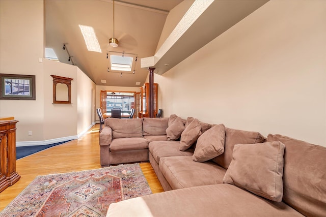 3337 Murdock Ave, Oceanside, NY 11572 - living area featuring high vaulted ceiling, wood finished floors, and ceiling fan