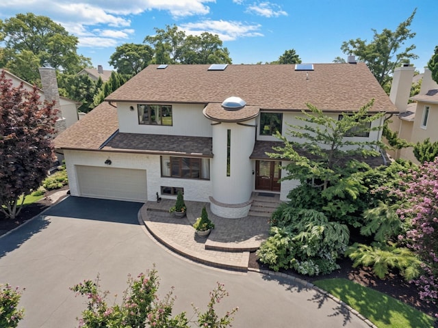 2000 Lake End Rd, Merrick, NY 11566 - view of front of house featuring a shingled roof, driveway, and a garage