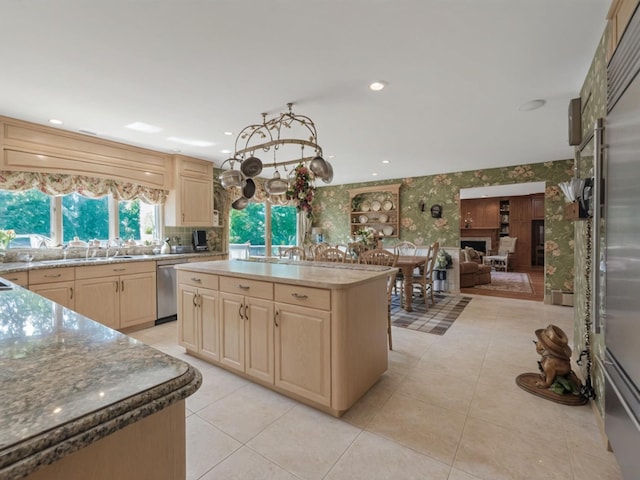 2000 Lake End Rd, Merrick, NY 11566 - kitchen featuring light brown cabinetry, wallpapered walls, stainless steel appliances, light tile patterned flooring, and tasteful backsplash