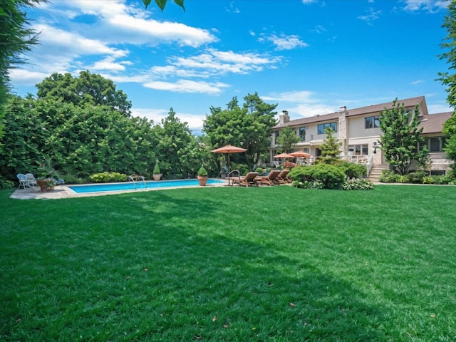 2000 Lake End Rd, Merrick, NY 11566 - view of grassy yard featuring an outdoor pool and a patio