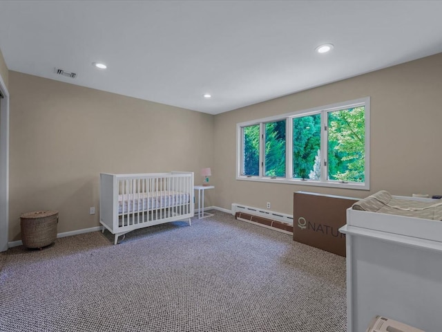 2000 Lake End Rd, Merrick, NY 11566 - carpeted bedroom with a baseboard heating unit and recessed lighting