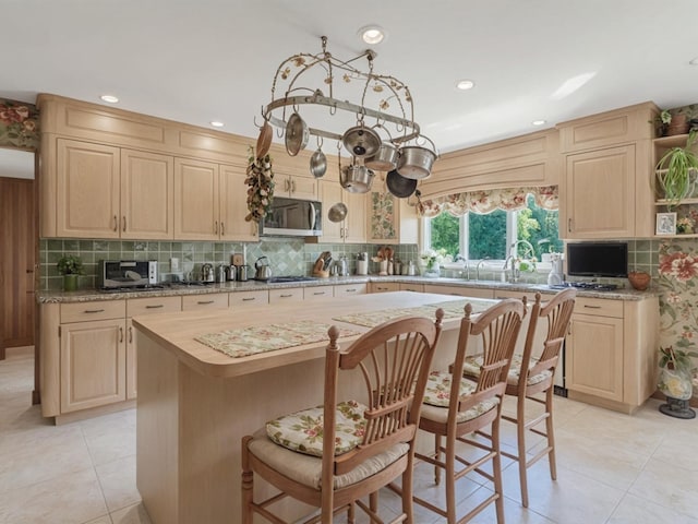 2000 Lake End Rd, Merrick, NY 11566 - kitchen featuring stainless steel appliances, light brown cabinets, light tile patterned floors, and recessed lighting