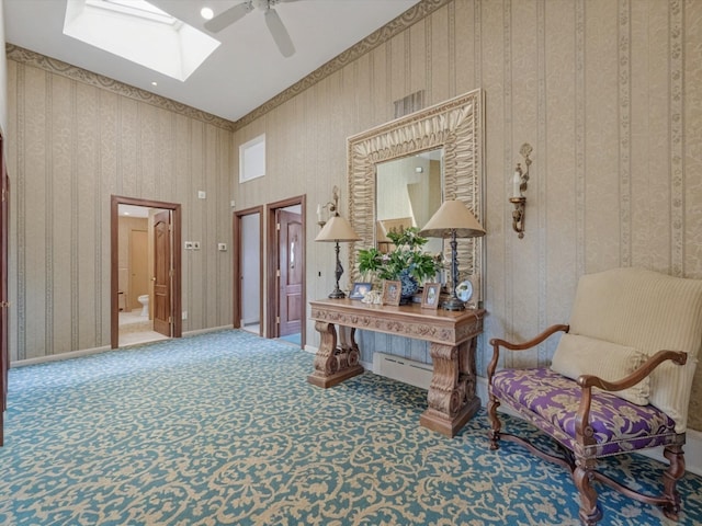 2000 Lake End Rd, Merrick, NY 11566 - carpeted foyer entrance with ceiling fan, a skylight, wallpapered walls, and a baseboard heating unit