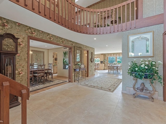 2000 Lake End Rd, Merrick, NY 11566 - foyer entrance with wallpapered walls, tile patterned flooring, a high ceiling, and recessed lighting