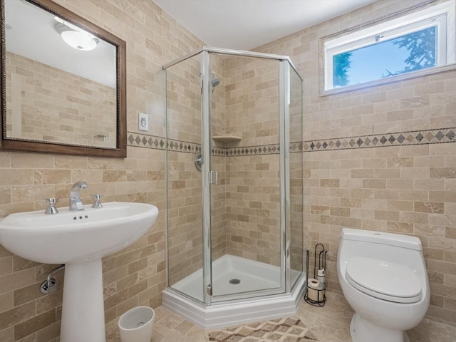 2000 Lake End Rd, Merrick, NY 11566 - bathroom with tile walls, a stall shower, and tile patterned flooring