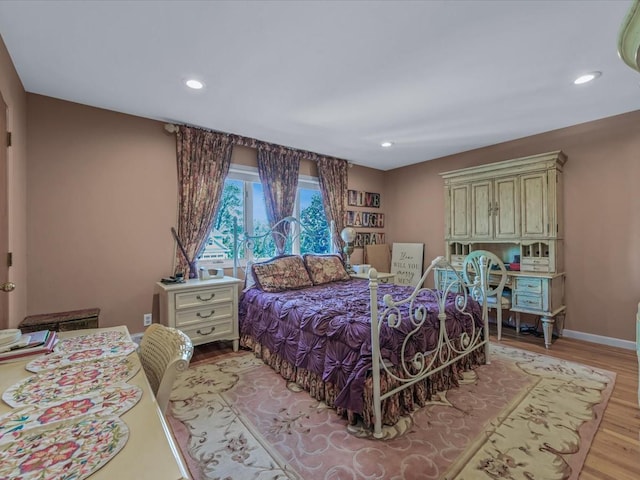 2000 Lake End Rd, Merrick, NY 11566 - bedroom with light wood-type flooring and recessed lighting