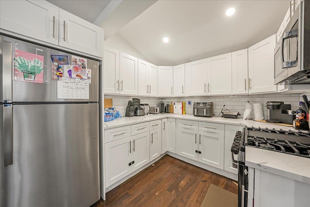 1098 Rte 311, Patterson, NY 12563 - kitchen featuring appliances with stainless steel finishes, dark wood-type flooring, backsplash, white cabinets, and recessed lighting