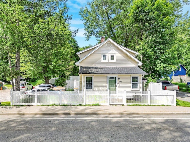 1098 Rte 311, Patterson, NY 12563 - bungalow featuring a chimney, a shingled roof, and a fenced front yard