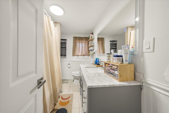 1098 Rte 311, Patterson, NY 12563 - bathroom featuring tile patterned floors, wainscoting, vanity, and a decorative wall