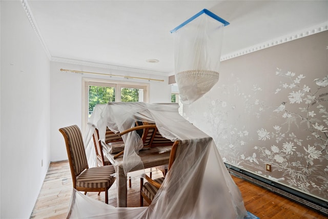 35 Stratford Ave, Dix Hills, NY 11746 - dining room with wood finished floors, crown molding, and a baseboard radiator