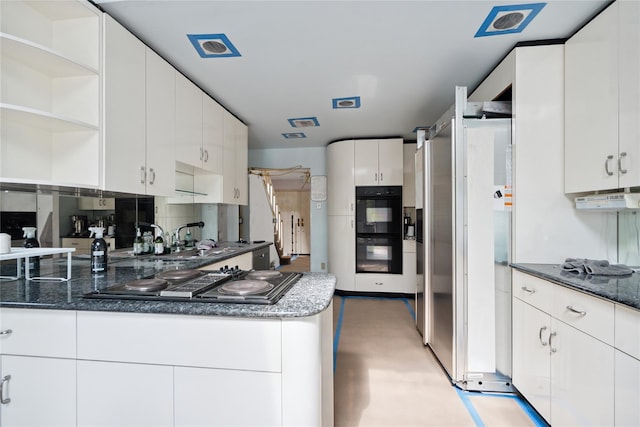 35 Stratford Ave, Dix Hills, NY 11746 - kitchen with black appliances, white cabinetry, open shelves, and dark stone countertops