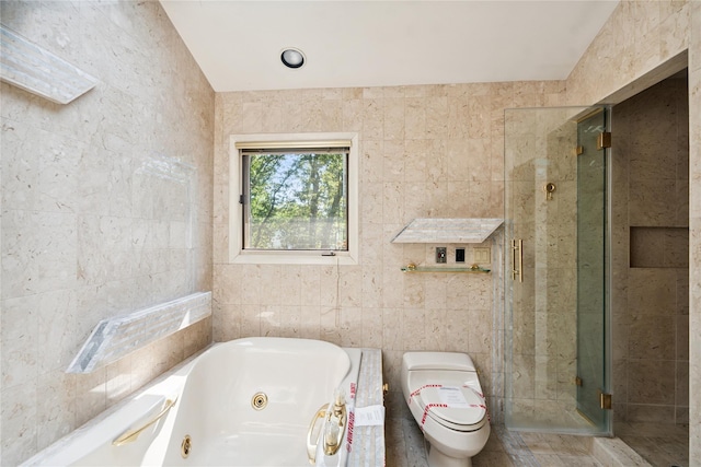 35 Stratford Ave, Dix Hills, NY 11746 - bathroom with tile walls, a jetted tub, and a stall shower