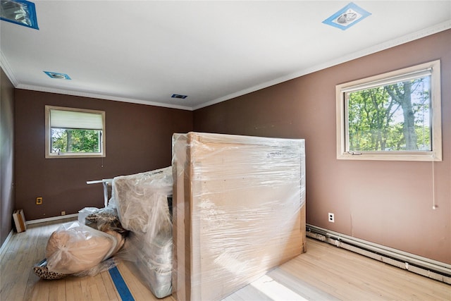 35 Stratford Ave, Dix Hills, NY 11746 - unfurnished bedroom with wood finished floors, ornamental molding, and a baseboard radiator