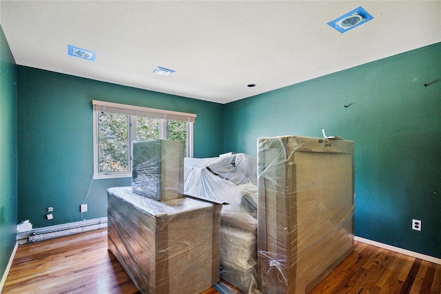 35 Stratford Ave, Dix Hills, NY 11746 - bedroom with a baseboard radiator and hardwood / wood-style flooring