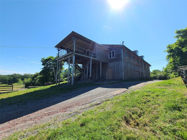 282 W Shore Rd, Swan Lake, NY 12783 - view of front of home with dirt driveway and a carport