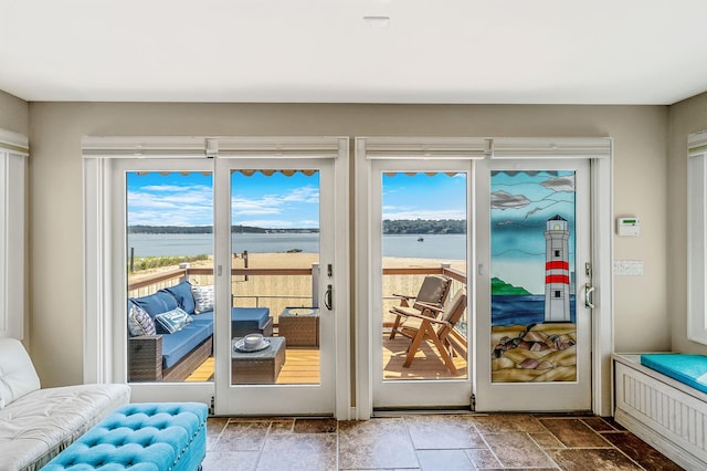 75 W Shore Rd Unit 4, Port Washington, NY 11050 - doorway to outside with a water view and stone finish flooring