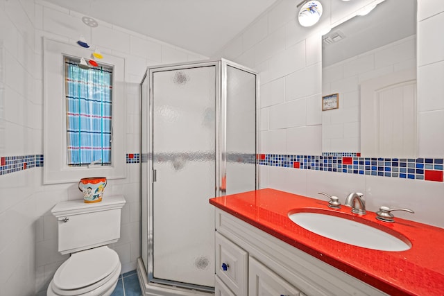 75 W Shore Rd Unit 4, Port Washington, NY 11050 - bathroom with tile walls, vanity, a shower stall, and tasteful backsplash