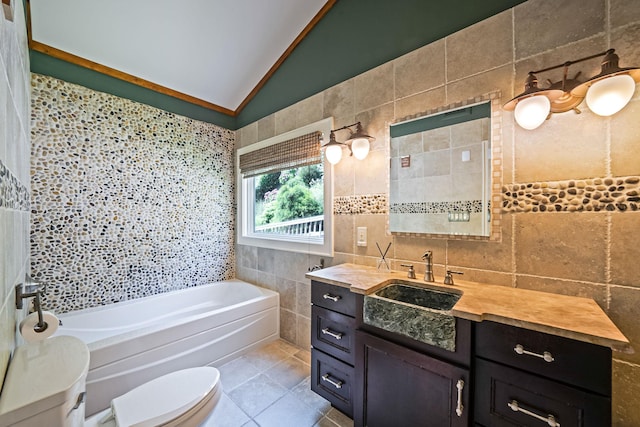 75 W Shore Rd Unit 4, Port Washington, NY 11050 - full bathroom featuring a tub to relax in, tile walls, tile patterned flooring, vaulted ceiling, and vanity