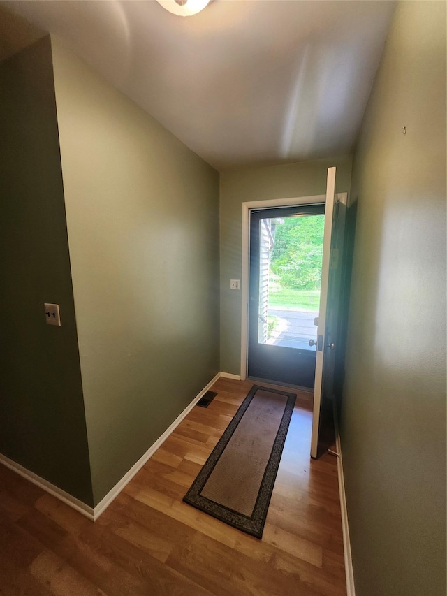 108 Village Rd Unit B, Jefferson Valley, NY 10598 - doorway with wood finished floors and baseboards