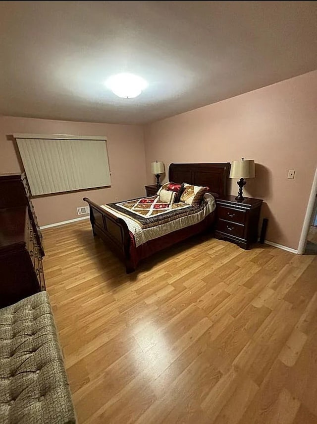 108 Village Rd Unit B, Jefferson Valley, NY 10598 - bedroom with light wood finished floors and baseboards