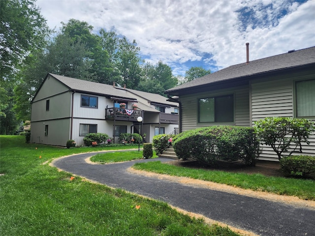 108 Village Rd Unit B, Jefferson Valley, NY 10598 - view of front facade with a front yard and a balcony