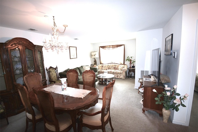 200 Woodcrest Ln Unit 222, Mount Kisco, NY 10549 - carpeted dining area with a chandelier