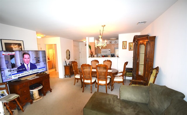 200 Woodcrest Ln Unit 222, Mount Kisco, NY 10549 - dining area featuring a chandelier and light carpet