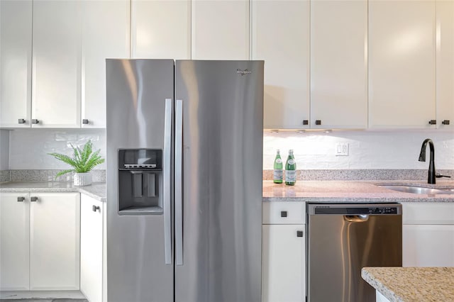 914 Wynnewood Rd Unit 3R, Pelham, NY 10803 - kitchen featuring appliances with stainless steel finishes, white cabinets, and backsplash