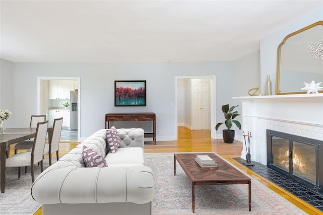 914 Wynnewood Rd Unit 3R, Pelham, NY 10803 - living area featuring light wood-style flooring and a fireplace