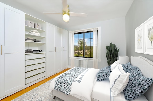 914 Wynnewood Rd Unit 3R, Pelham, NY 10803 - bedroom with light wood-type flooring, radiator, and a ceiling fan