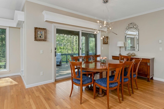 623 Heritage Hls Unit B, Somers, NY 10589 - dining area with light wood-style floors, plenty of natural light, crown molding, and a chandelier