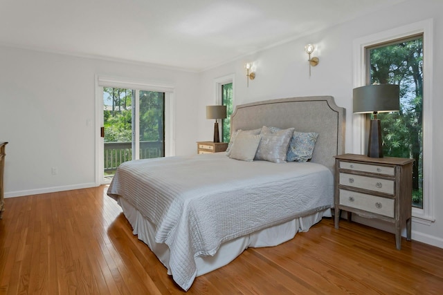 623 Heritage Hls Unit B, Somers, NY 10589 - bedroom featuring access to outside, wood finished floors, and crown molding