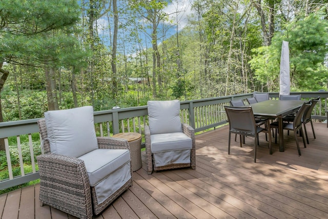 623 Heritage Hls Unit B, Somers, NY 10589 - wooden terrace featuring outdoor dining area and a view of trees