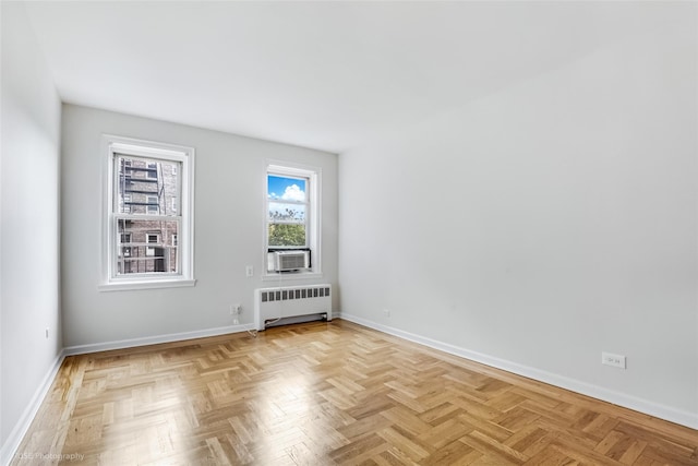 48-55 43rd St Unit 4H, Woodside, NY 11377 - empty room with radiator heating unit and cooling unit