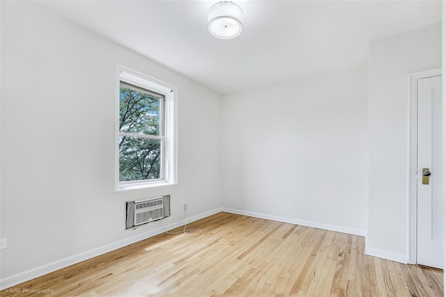 48-55 43rd St Unit 4H, Woodside, NY 11377 - spare room featuring an AC wall unit and wood finished floors