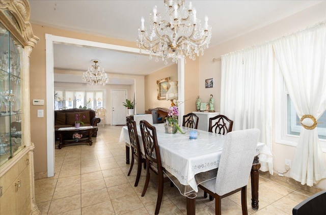 10719 Sutter Ave, Ozone Park, NY 11417 - dining space featuring a chandelier and light tile patterned floors