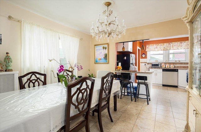 10719 Sutter Ave, Ozone Park, NY 11417 - dining area featuring a chandelier and light tile patterned floors