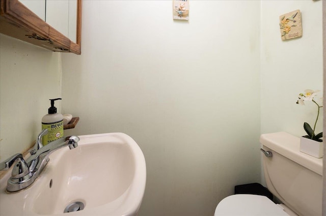 10719 Sutter Ave, Ozone Park, NY 11417 - half bath with a sink and toilet