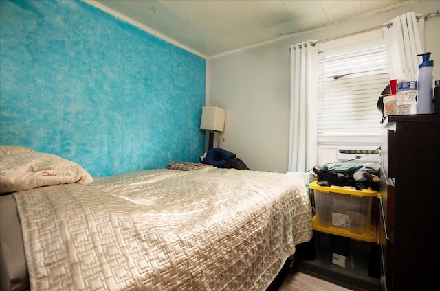 10719 Sutter Ave, Ozone Park, NY 11417 - bedroom featuring ornamental molding and wood finished floors