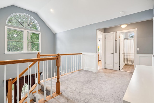 5 Aspen Cir, Saint James, NY 11780 - hall featuring lofted ceiling, an upstairs landing, carpet, and wainscoting