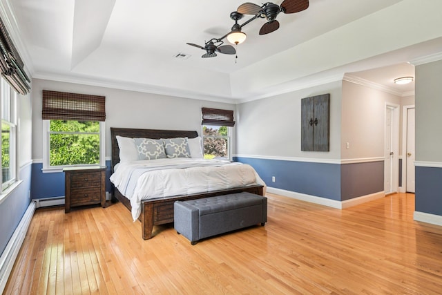 5 Aspen Cir, Saint James, NY 11780 - bedroom with a raised ceiling, hardwood / wood-style floors, crown molding, a baseboard radiator, and a ceiling fan