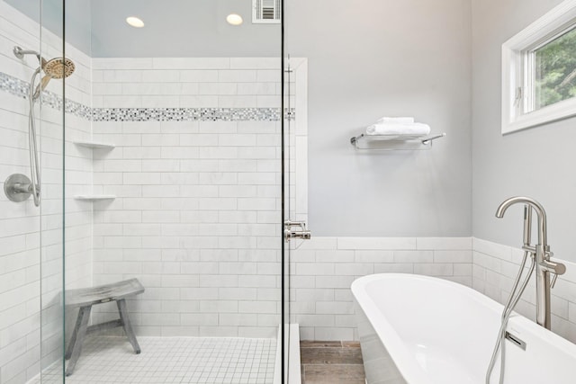 5 Aspen Cir, Saint James, NY 11780 - full bath featuring a shower stall, tile walls, a freestanding bath, and recessed lighting