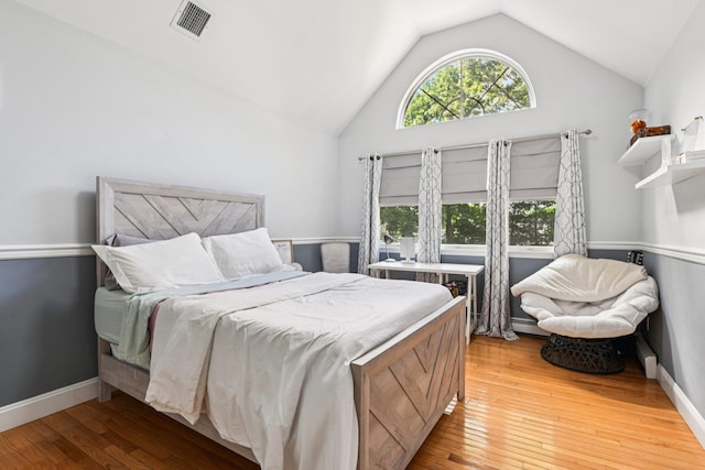 5 Aspen Cir, Saint James, NY 11780 - bedroom with lofted ceiling, light wood finished floors, and a baseboard heating unit