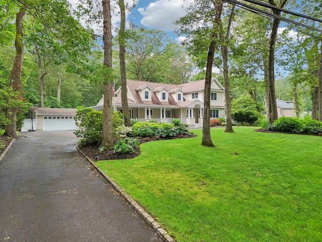 23 Alpine Way S, Huntington, NY 11746 - view of front of house featuring a garage, a front lawn, a porch, and driveway