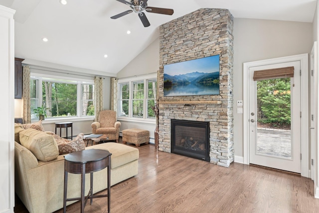 23 Alpine Way S, Huntington, NY 11746 - living room featuring a ceiling fan, wood finished floors, a stone fireplace, recessed lighting, and high vaulted ceiling